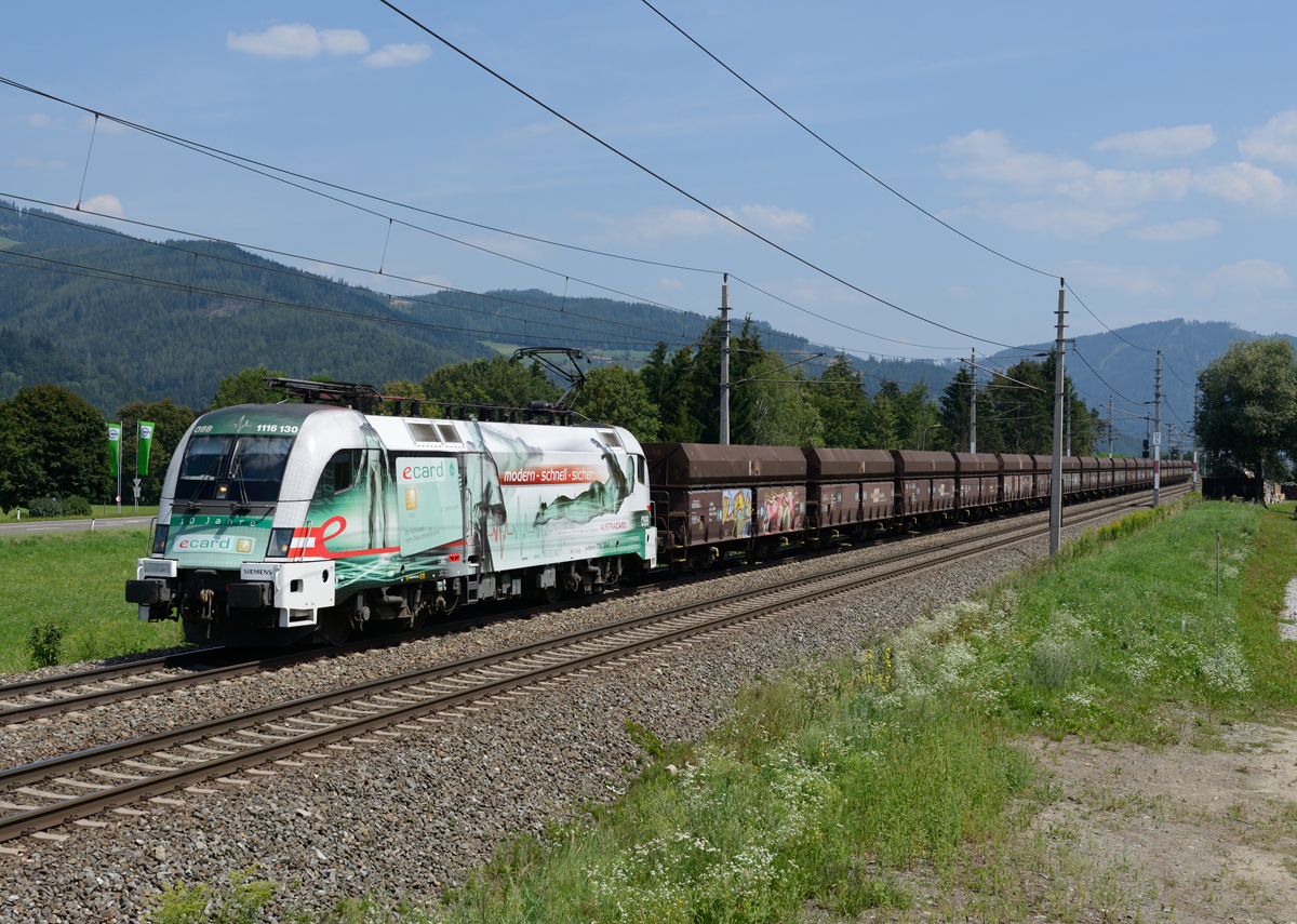 Am 10. August 2015 war die 1116 130  E-Card  mit dem 57678 von Retznei nach Donawitz unterwegs und wurde von mir in Waltenbach bei Niklasdorf fotografiert. 