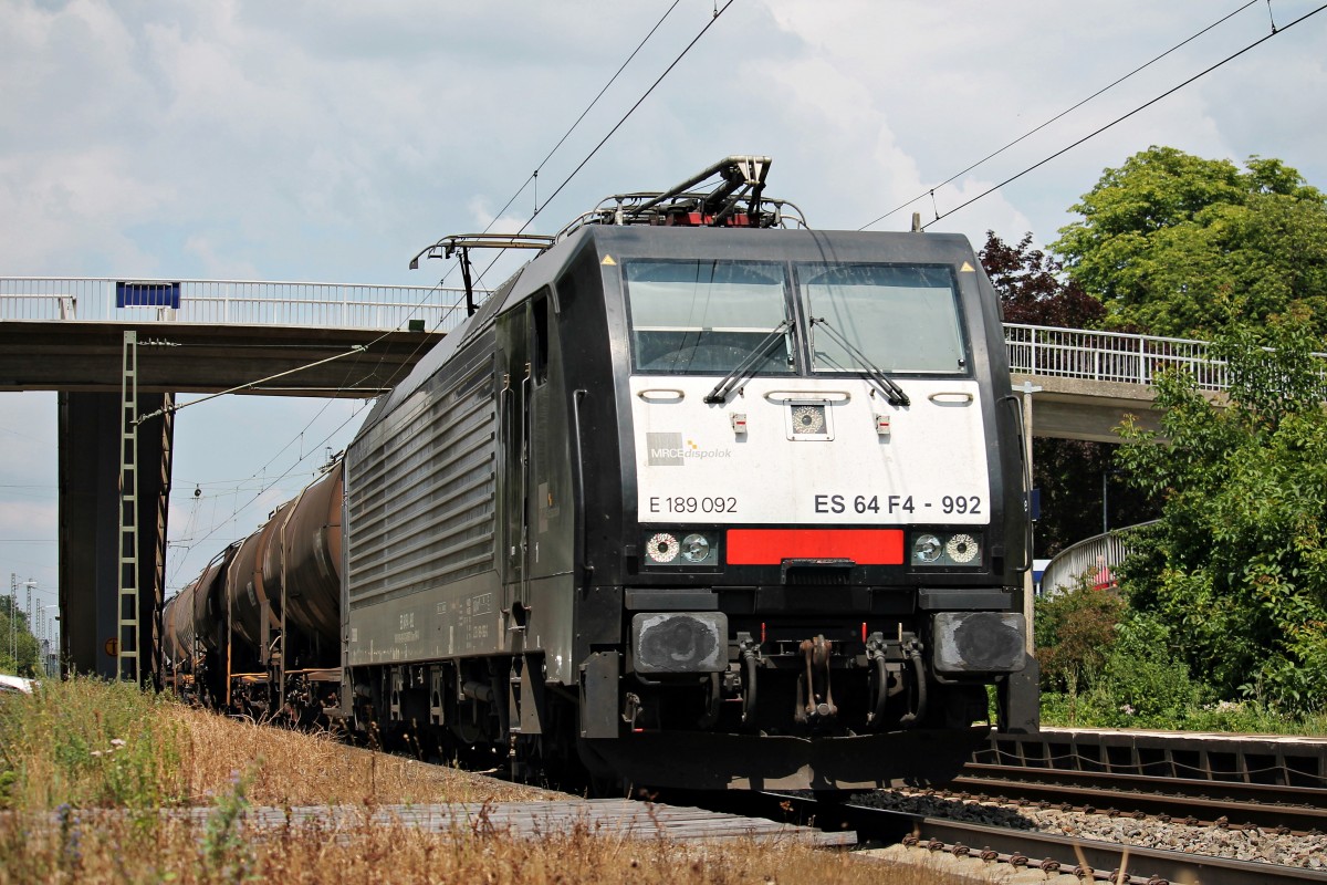 Am 11.07.2014 fuhr SBB Cargo ES 64 F4-992 mit einem Kesselzug durch den Bahnhof von Orschweier in Richtung Schweiz.