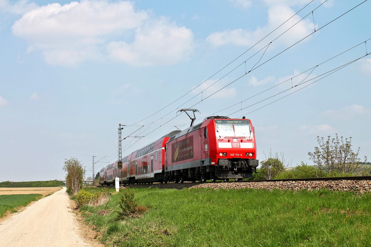 Am 13.04.2014 fuhr 146 114-4  Baden-Württemberg erfahren  mit einem RE aus Offenburg nach Basel Bad Bf, als sie kurz vor dem nächsten Halt in Müllheim (Baden) ist.