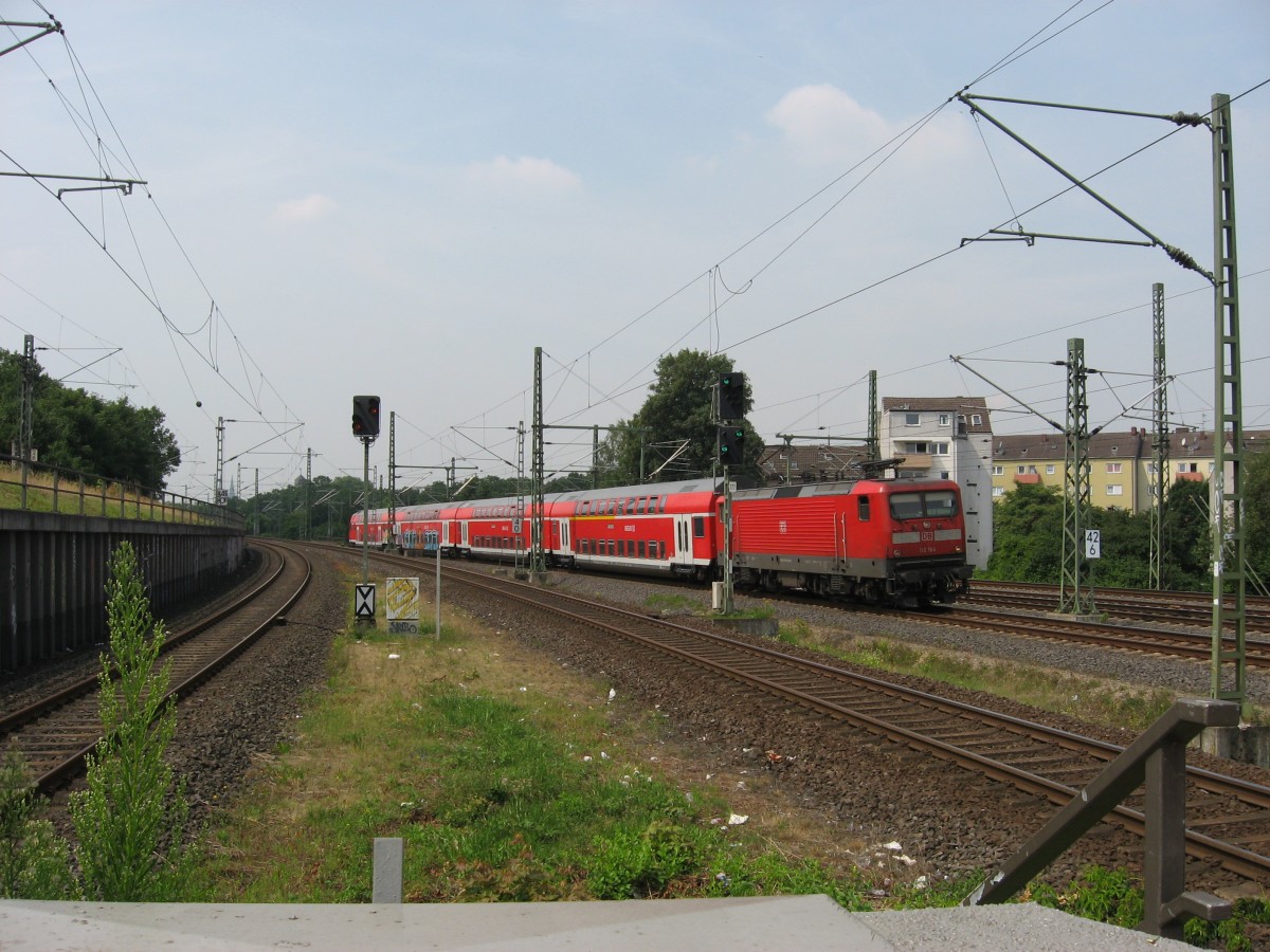 Am 16.7.13 konnte ich 112 146 (ohne Prfkontrollziffer) mit dem RE 7 Richtung Rheine am Haken kurz vor dem Haltepunkt K-Buchforst fotografieren