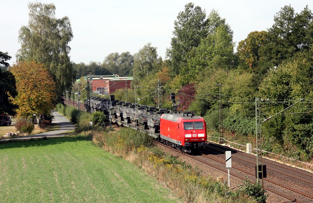 Am 16.9.2018 kam 145058 der DB mit einem Bundeswehr Panzerzug, beladen mit Marder Schützenpanzern, auf der Rollbahn um 12.00 Uhr in Richtung Osnabrück vorbei.