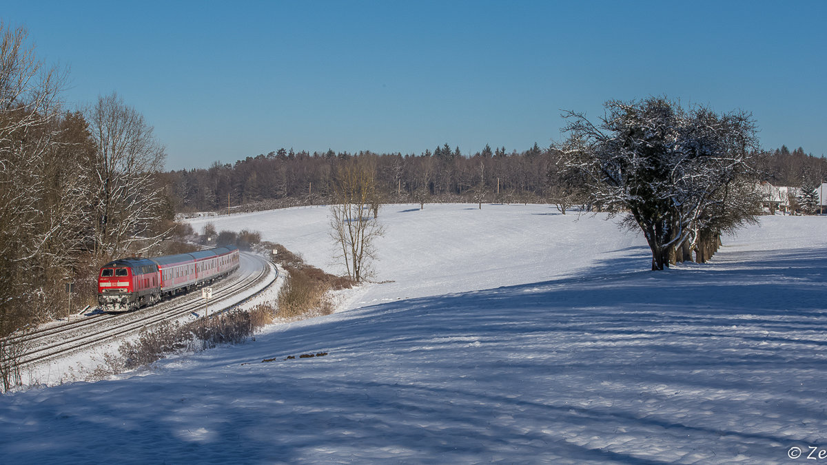 Am 18.01.2016 zieht 218 406-7 den IRE 4225 bei Lohner in Richtung Lindau, nächster Halt: Meckenbeuren.