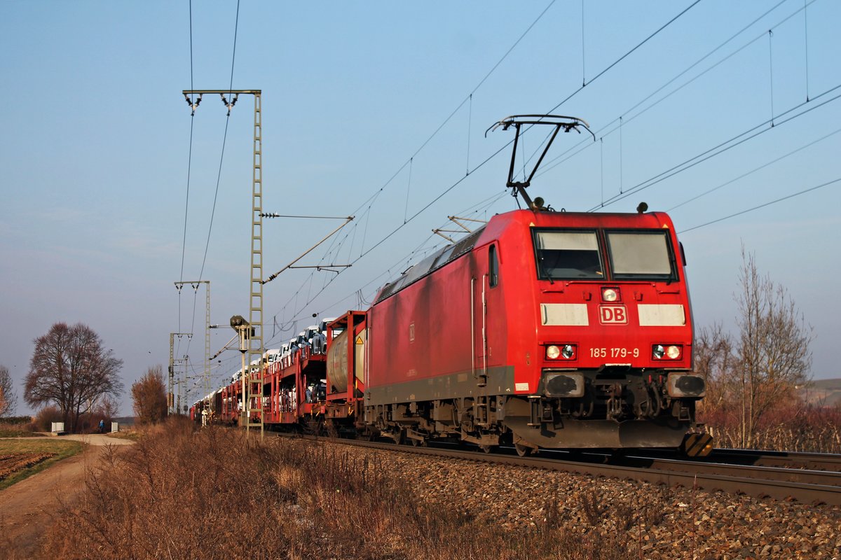 Am 21.02.2018 fuhr 185 179-9 mit einem gemischte Güterzug (Mannheim Rbf - Basel Bad Rbf) nördlich von Müllheim (baden) durchs Rheintal in Richtung Zielbahnhof.