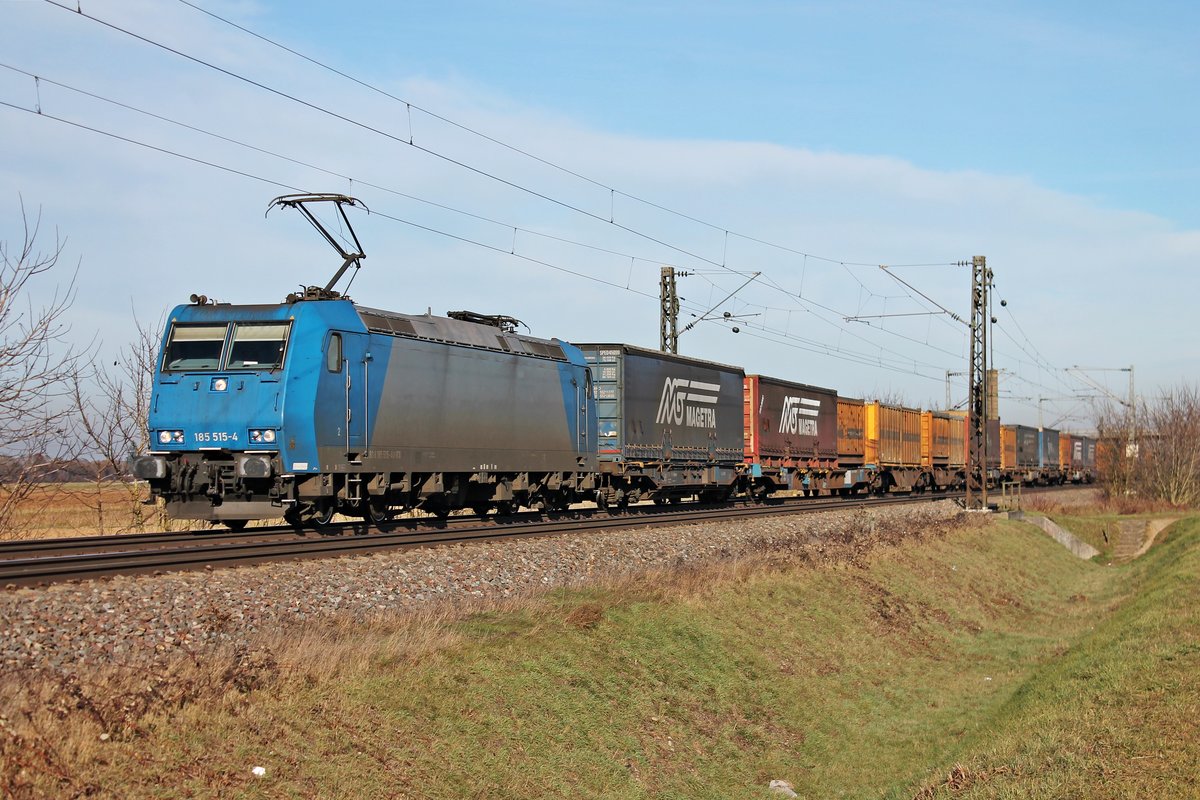 Am 22.12.2016 fuhr ATLU/RTX 185 515 mit ihrem KLV aus (Zeebrugge - Milano Segrate), den sie seit Aachen West bespannt, auf der KBS 703 auf Höhe der kleinen Ortschaft Hügelheim und hat nur noch wenige Kilometer vor sich, bis zur Schweizer Grenze. Dort wird sie dann ihren Zug an BLSC abgeben.