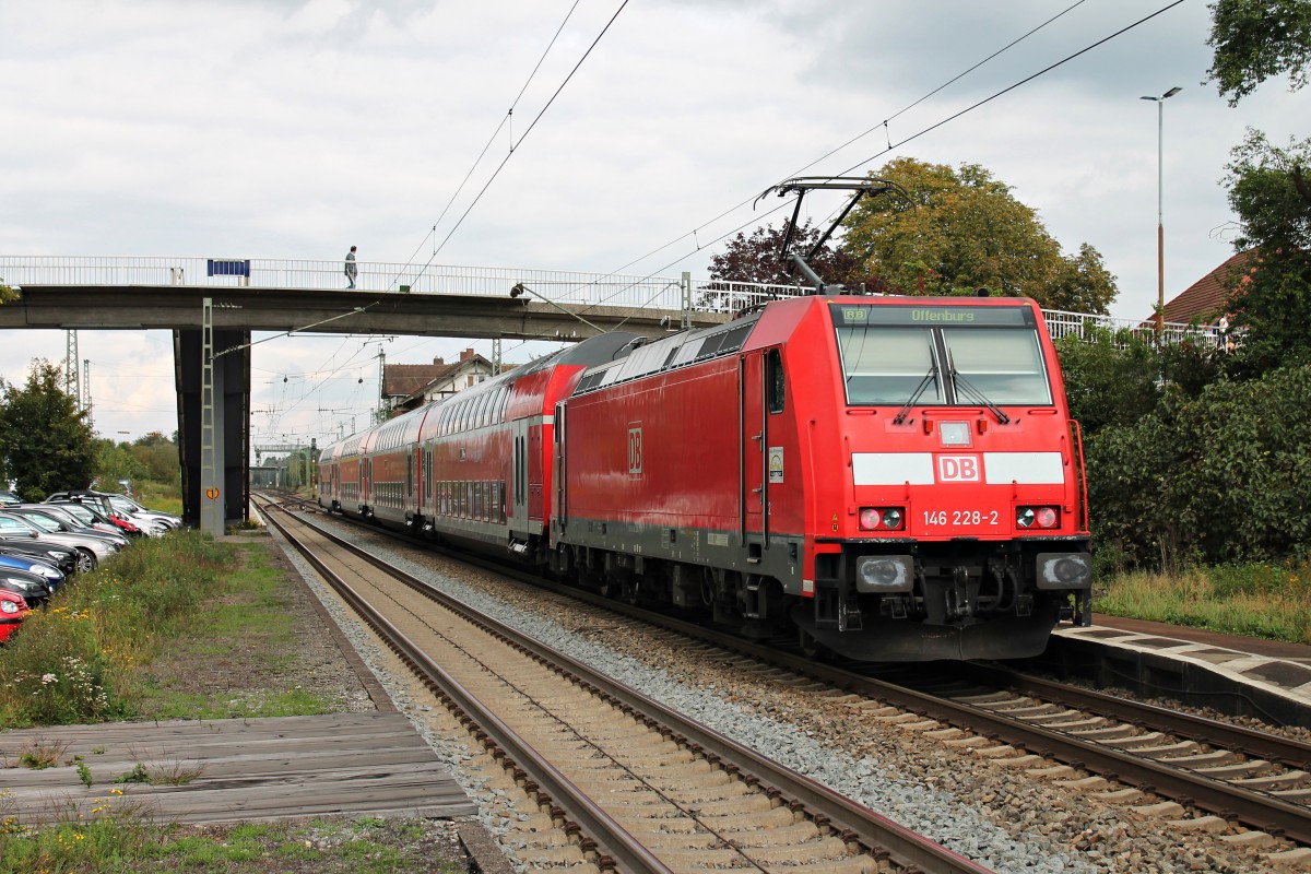 Am 25.09.2014 fuhr die Freiburger 146 228-2 mit einer RB (Basel Bad Bf - Offenburg) in den Bahnhof von Orschweier ein.