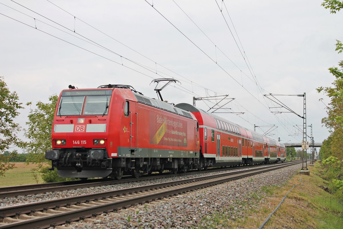 Am Mittag des 19.05.2019 fuhr die Freiburger 146 115  Landkreis Breisgau-Hochschwarzwald  mit ihrer RB (Freiburg (Brsg) Hbf - Neuenburg (Baden)) bei Hügelheim über die Rheintalbahn in Richtung Müllheim (baden), wo sie ihren vorletzten Zwischenhalt einlegen wird, bevor sie dann auf die Strecke gen Neuenburg (Baden)/Frankreich abbiegen wird.