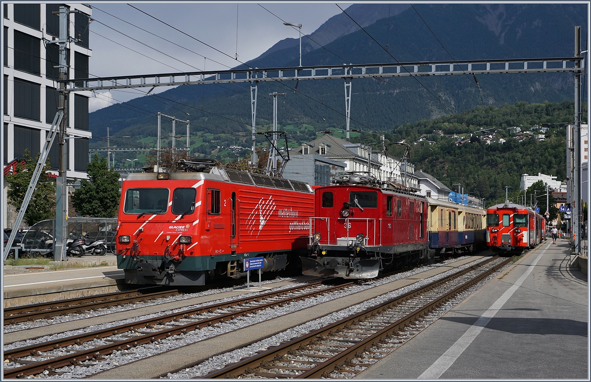 Auf der Rückfahrt, welch freudige Überraschung, stand im MGB Bahnhof von Brig neben der MGB HGe 4/4 II  Monte Rosa  die FO HGe 4/4 36 (Baujahr 1948) mit dem  Glacier Pullman Express .

31. August 2019