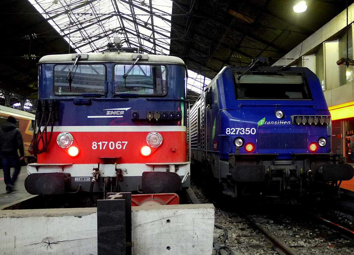 Bunte Vielfalt im eher düsteren Pariser Bahnhof  Saint-Lazare : BB 8000er E-Lok und eine moderne Elektrolokomotive der Baureihe BB 27000. 16.1.2014