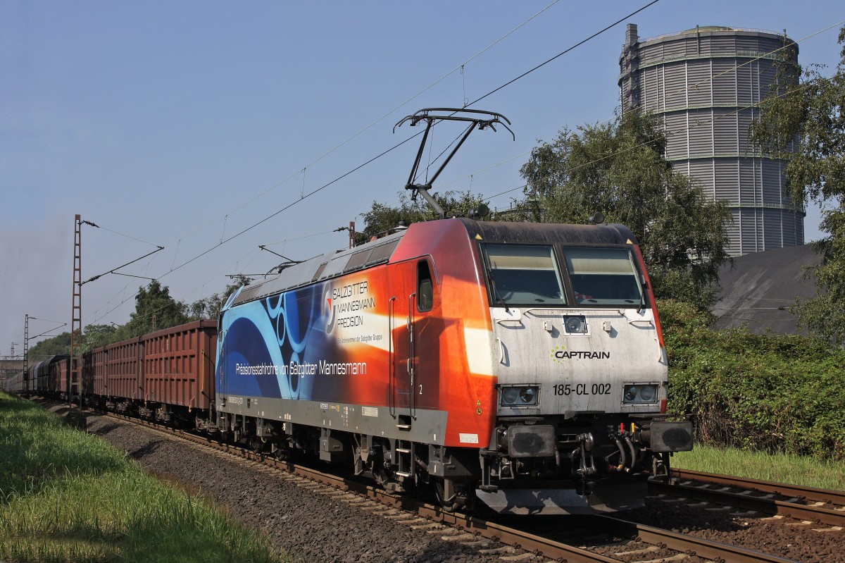 Captrain 185-CL 002 mit Güterzug am 12.08.2015 auf der Emscherbahn bei Bottrop.