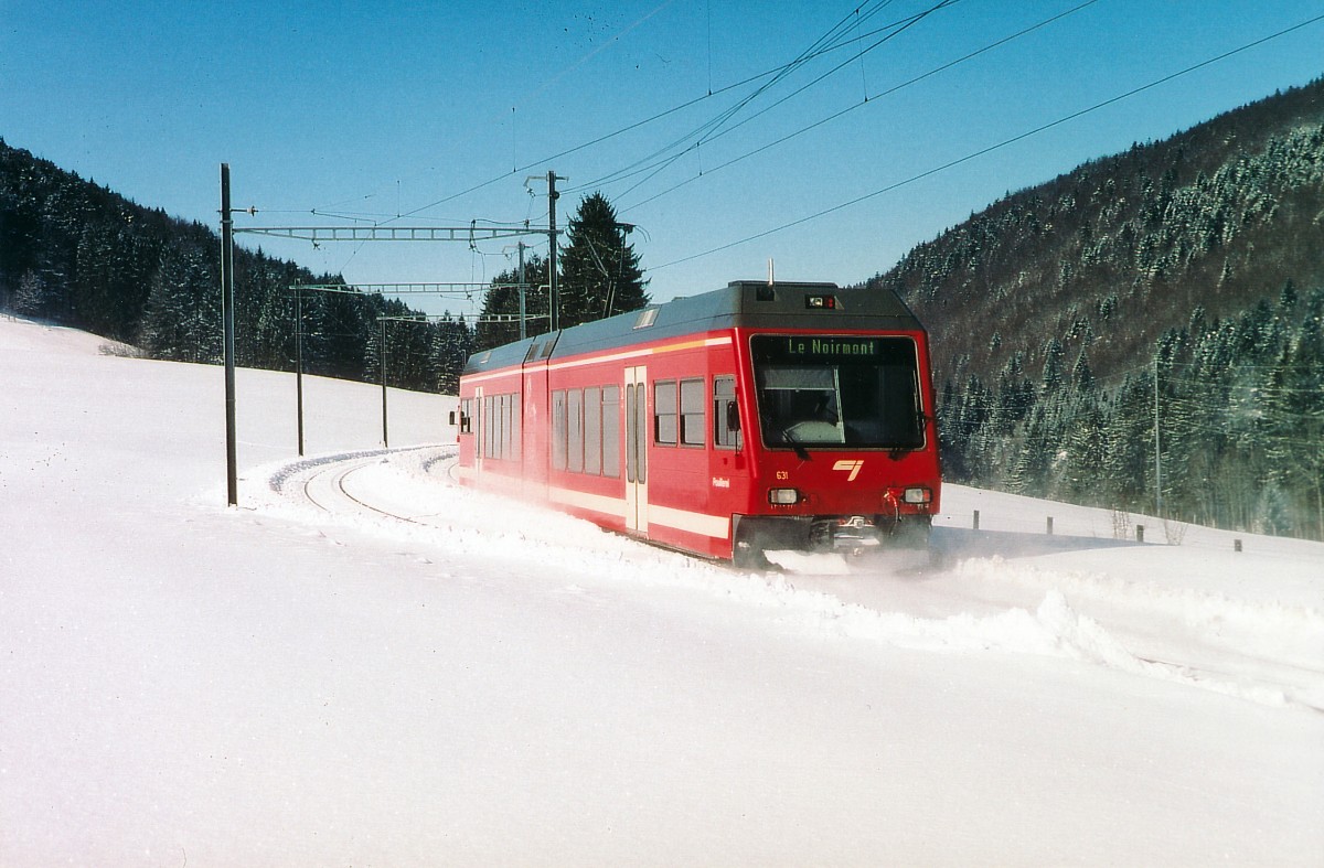 CJ: Regionalzug Tavannes-Le Noirmont mit ABe 2/6 631 zwischen Tavannes und Tramelan im Februar 2004.
Foto: Walter Ruetsch
