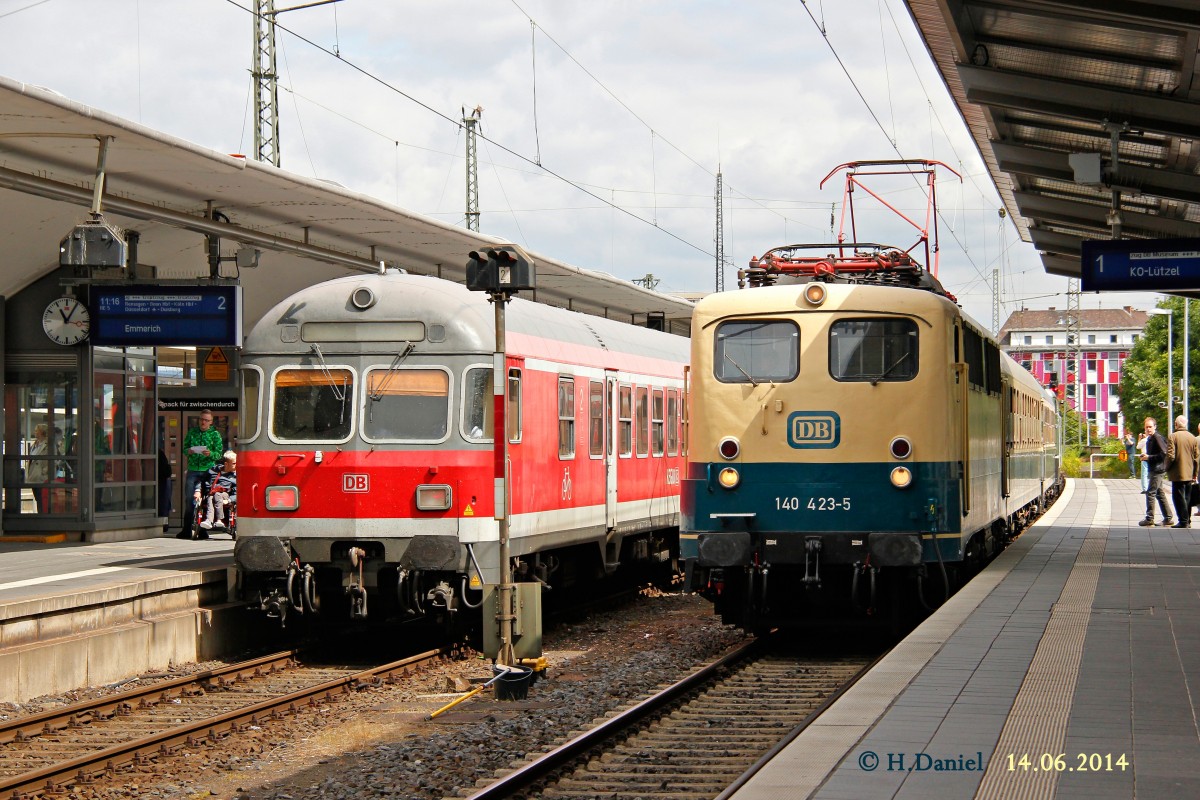 DB 140 423-5 mit Pendelzug & links RE5 in Koblenz Hbf, Juni 2014.