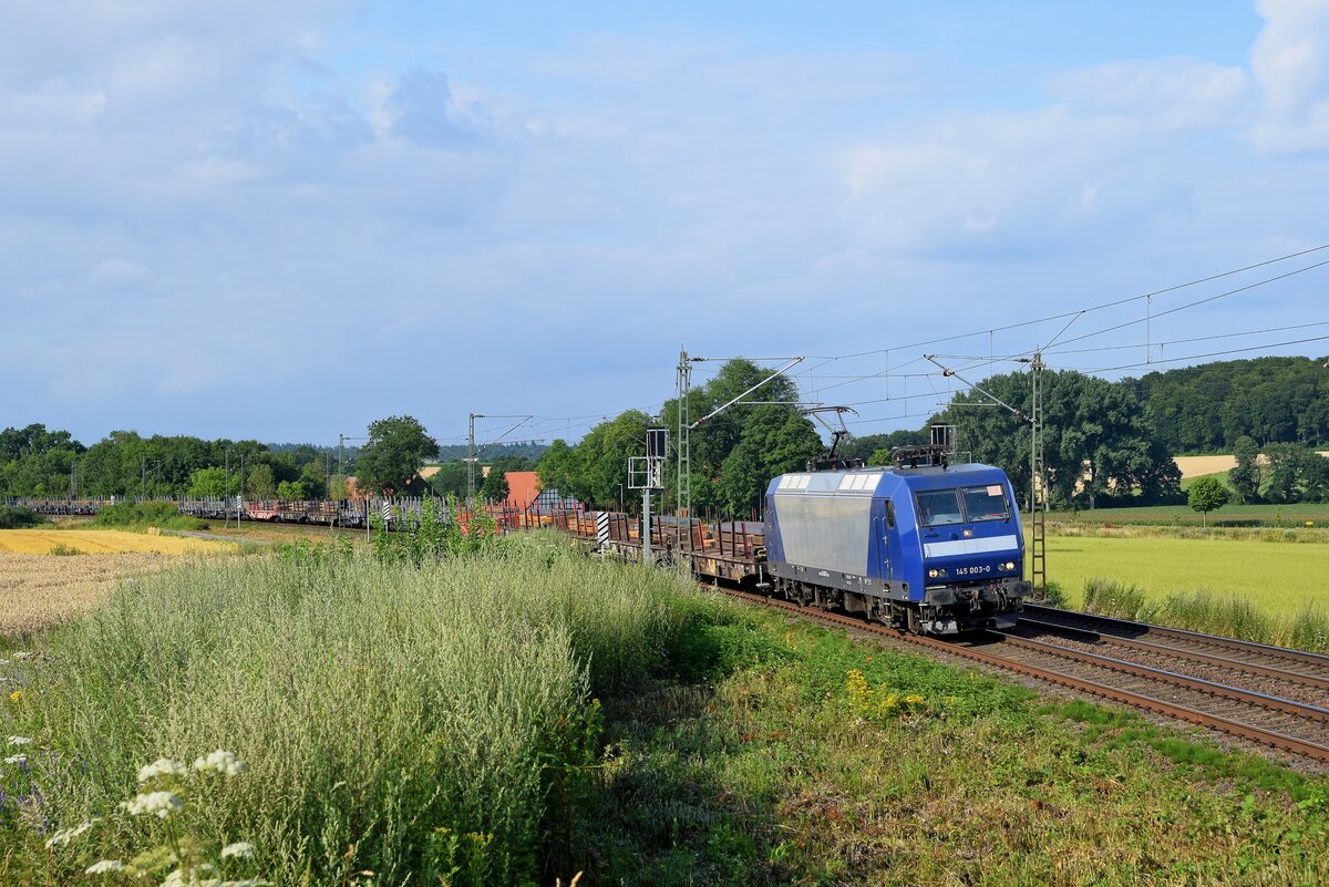 DB Cargo 145 003 mit Brammenzug in Richtung Osnabrück (Vehrte, 20.07.2021).