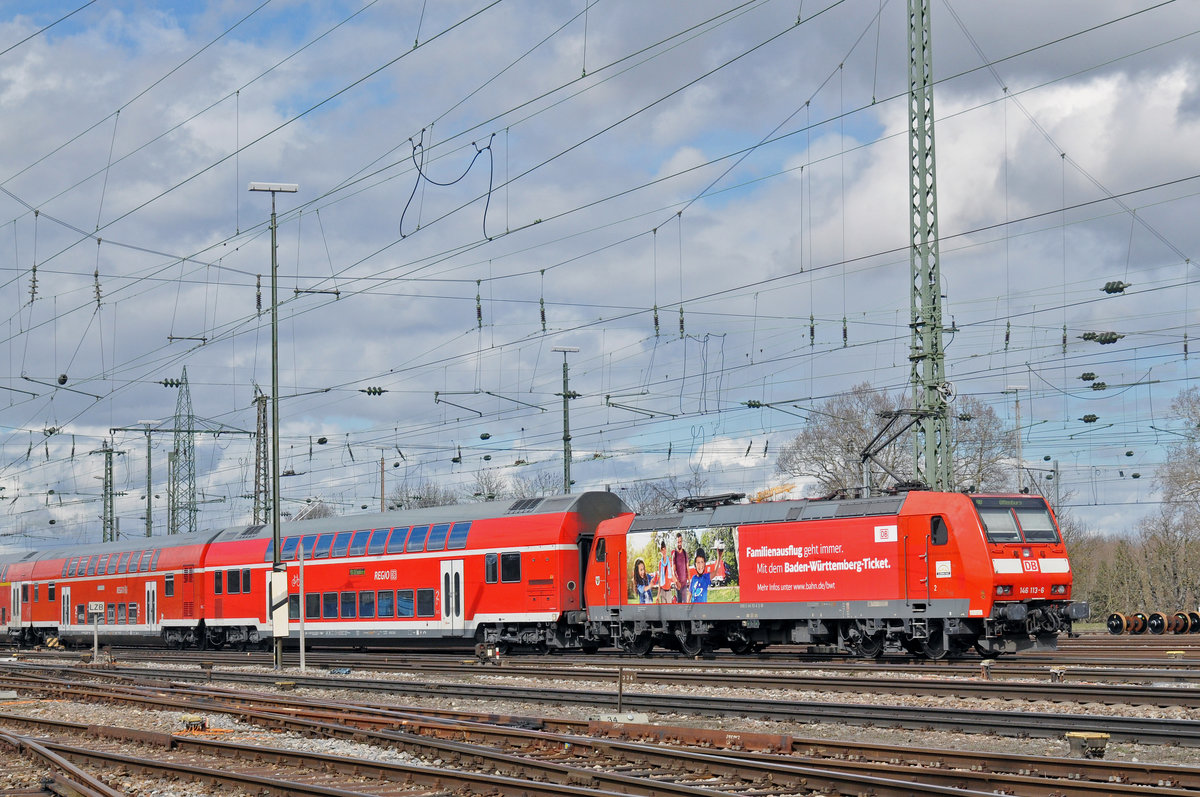 DB Lok 146 113-6 fährt beim Badischen Bahnhof ein. Die Aufnahme stammt vom 16.03.2018.