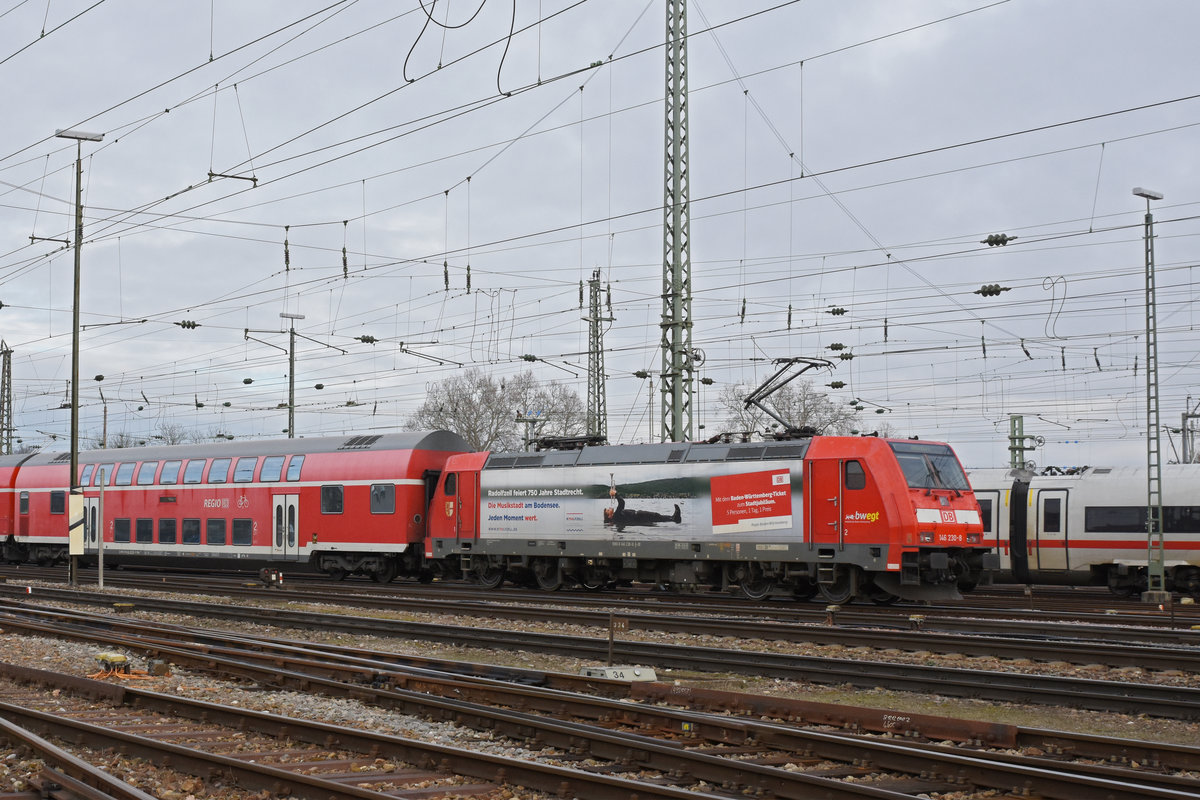 DB Lok 146 230-8 fährt beim badischen Bahnhof ein. Die Aufnahme stammt vom 08.01.2020.