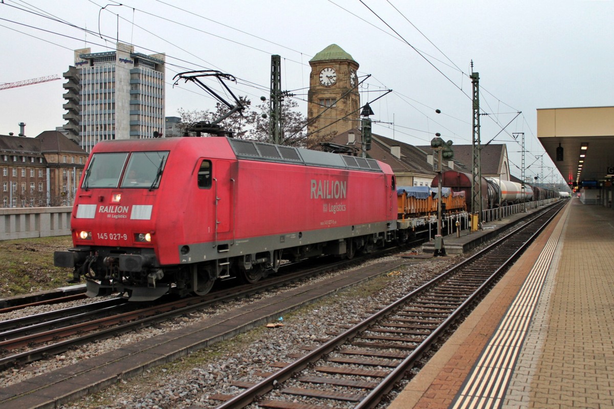 DB Schenker 145 027-9 ebenfalls am 15.01.2014 mit einem gemischten Güterzug bei der Durchfahrt auf Gleis 1 in Basel Bad Bf gen Muttenz.