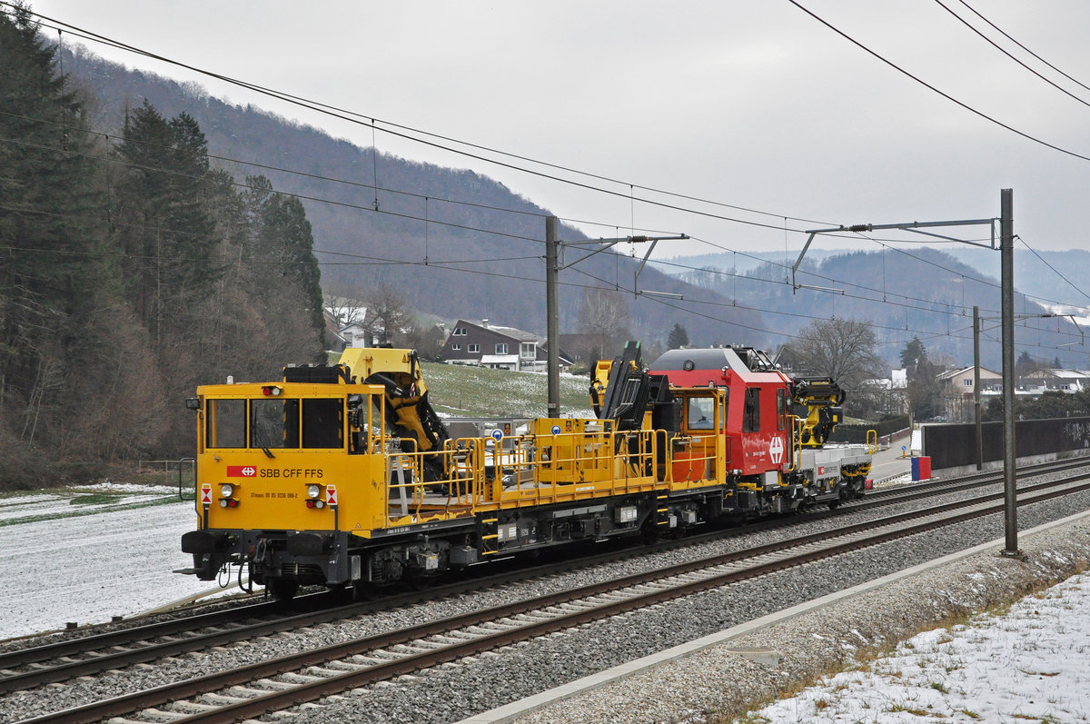 Der Tm 234 411-7 schleppt den XTmass 99 85 9236 088-2 Richtung Bahnhof Tecknau. Die Aufnahme stammt vom 11.01.2021.