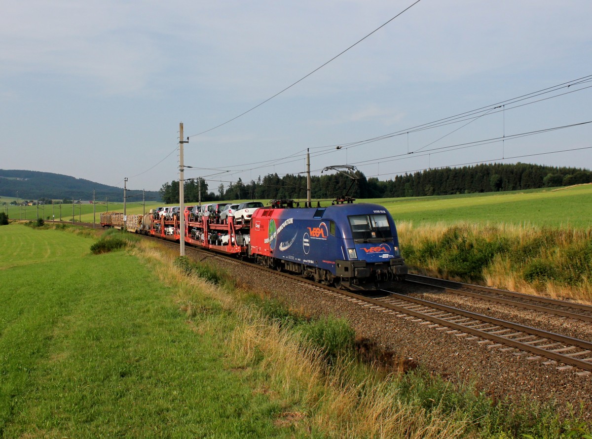 Die 1116 168 mit einem Güterzug am 17.07.2015 unterwegs bei Weng.