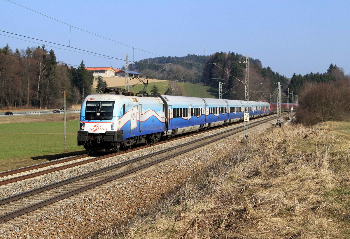 Die 1116 251 mit dem Ski Austria Railjet als Korridorzug Richtung Rosenheim bei Übersee am 07.03.2014