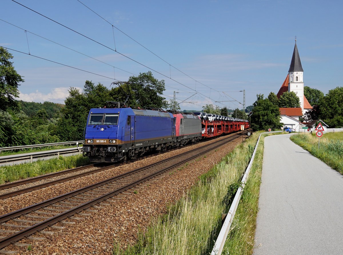 Die 185 595 und die 185 590 mit einem Autozug am 20.06.2019 unterwegs bei Hausbach.
