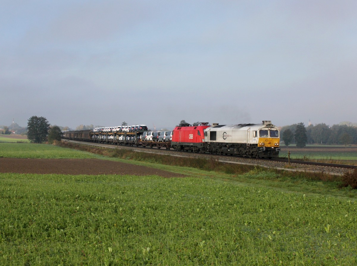 Die 247 056 und die 1116 136 mit einem Gterzug am 19.10.2013 unterwegs bei Dorfen.
