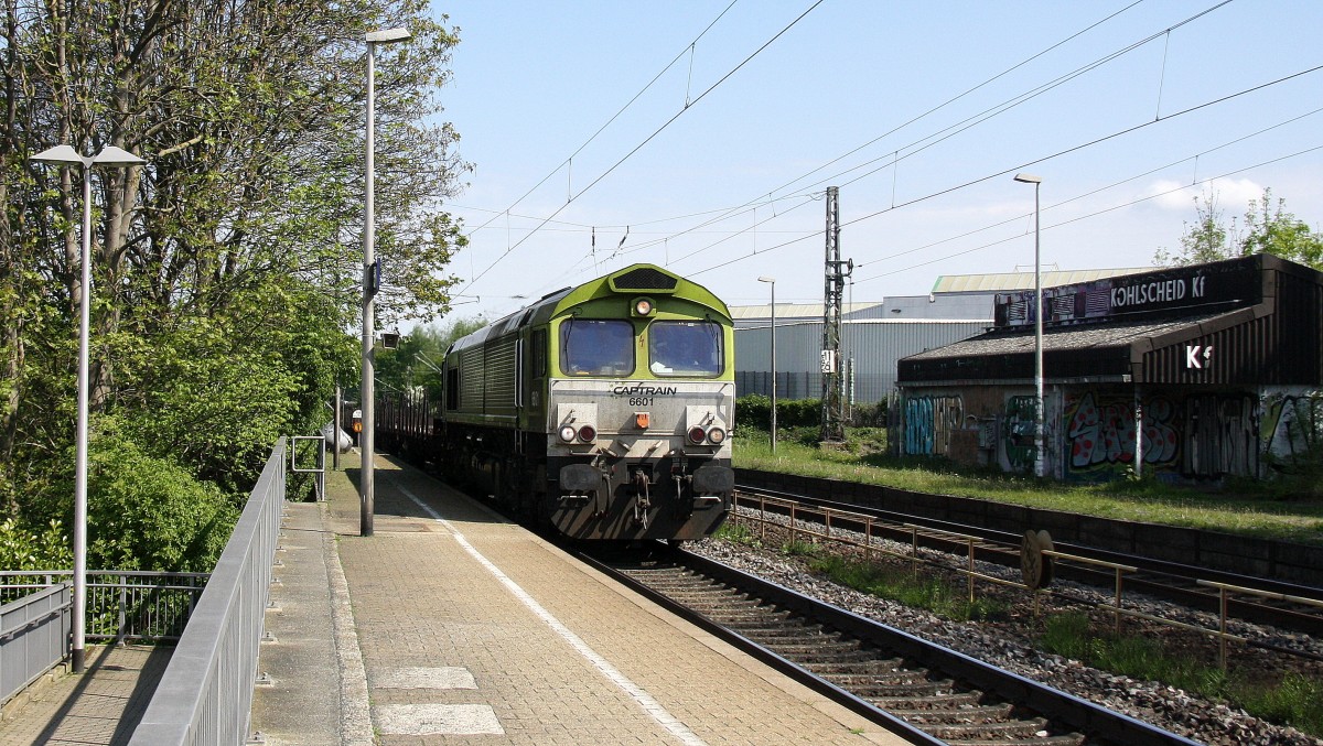 Die Class 66 6601 von Captrain kommt durch Kohlscheid aus Richtung Neuss,Herzogenrath  und fährt in Richtung Aachen-West mit einem Aluminiumleerzug aus Nievenheim bei Dormagen nach Kinkempois(B)Dunkerque(F) und fährt die Kohlscheider-Rampe hoch nach Aachen-West bei schönem Frühlingswetter am Mittag vom 26.4.2014.