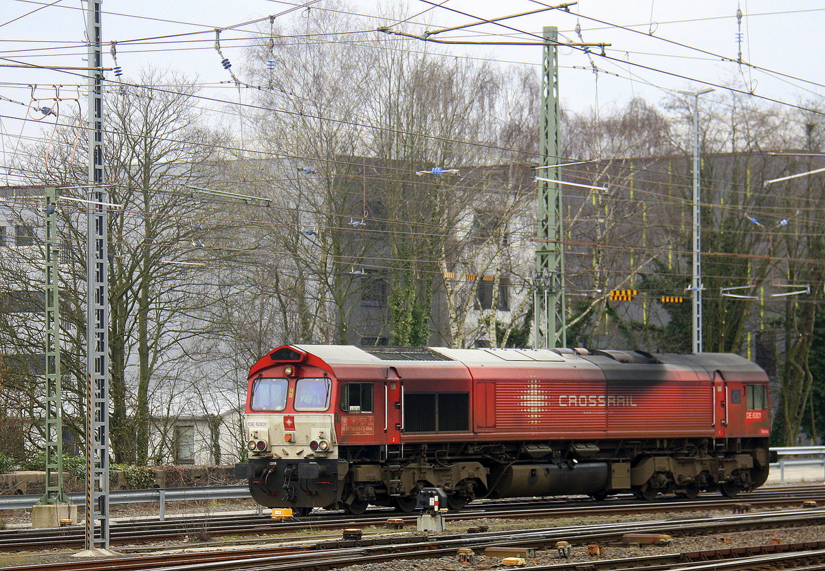 Die Class 66 DE6301  Debora  von Crossrail rangiert in Aachen-West. 
Aufgenommen vom Bahnsteig in Aachen-West.
Bei Regenwolken am Nachmittag vom 24.3.2016.