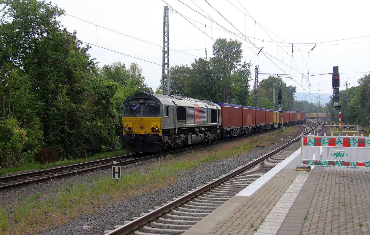 Die Class 66 DE6309 von Crossrail  kommt mit einem MSC-Containerzug aus Antwerpen-Krommenhoek(B) nach Germersheim(D) und kommt aus Richtung Aachen-West,Aachen-Schanz,Aachen-Hbf und fährt durch Aachen-Rothe-Erde in Richtung Eilendorf,Stolberg-Hbf(Rheinland),Eschweiler-Hbf,Langerwehe,Düren,Merzenich,Buir,Horrem,Kerpen-Köln-Ehrenfeld,Köln-West,Köln-Süd. 
Aufgenommen vom Bahnsteig 1 in Aachen-Rothe-Erde.
Bei Wolken am Nachmittag vom 3.9.2018.