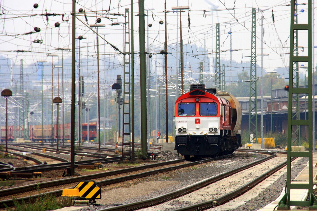 Die Class 66 DE6310  Griet  von Crossrail steht mit einem  Getreidewagen in Aachen-West bei Sonne und Wolken am 12.10.2013.