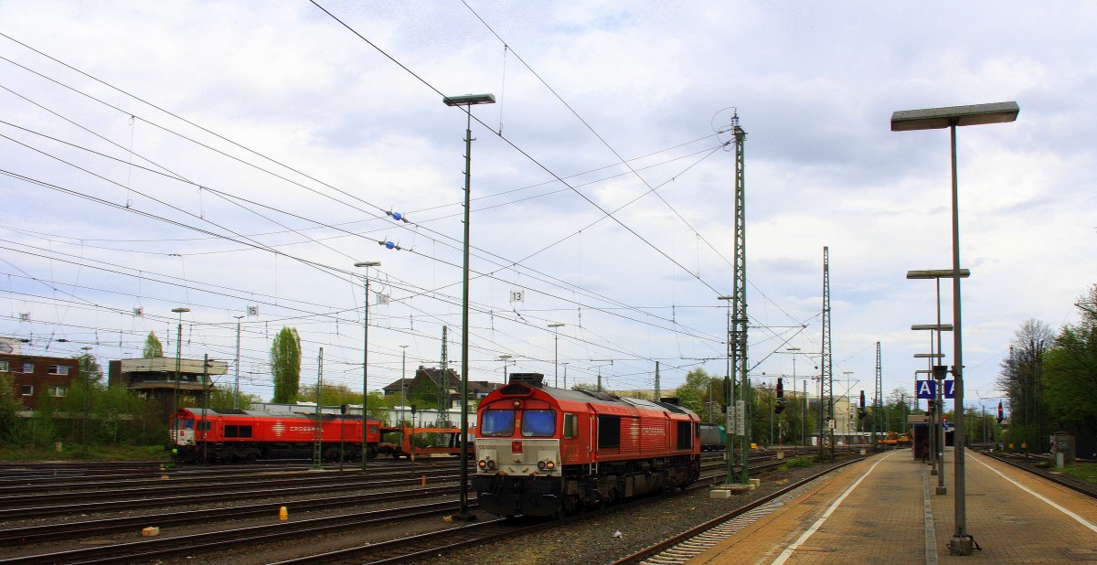 Die Class 66 DE6310  Griet  von Crossrail als Lokzug aus Montzen(B) und fährt in Aachen-West ein und Hintergrund steht eine Class 66 PB03  Mireille  von Crossrail mit Motor an.
Aufgenommen vom Bahnsteig in Aachen-West bei Sonne und Regenwolken am Nachmittag vom 6.4.2014.  