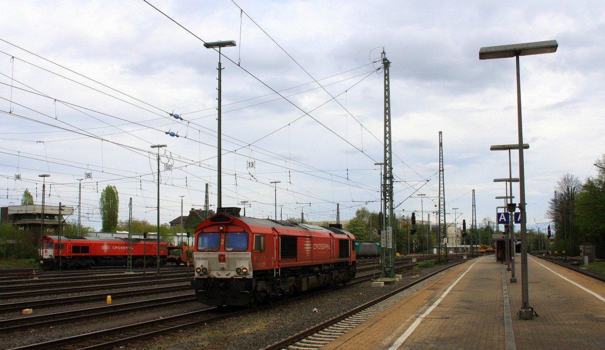 Die Class 66 DE6310  Griet  von Crossrail als Lokzug aus Montzen(B) und fährt in Aachen-West ein und Hintergrund steht eine Class 66 PB03  Mireille  von Crossrail mit Motor an.
Aufgenommen vom Bahnsteig in Aachen-West bei Sonne und Regenwolken am Nachmittag vom 6.4.2014.  