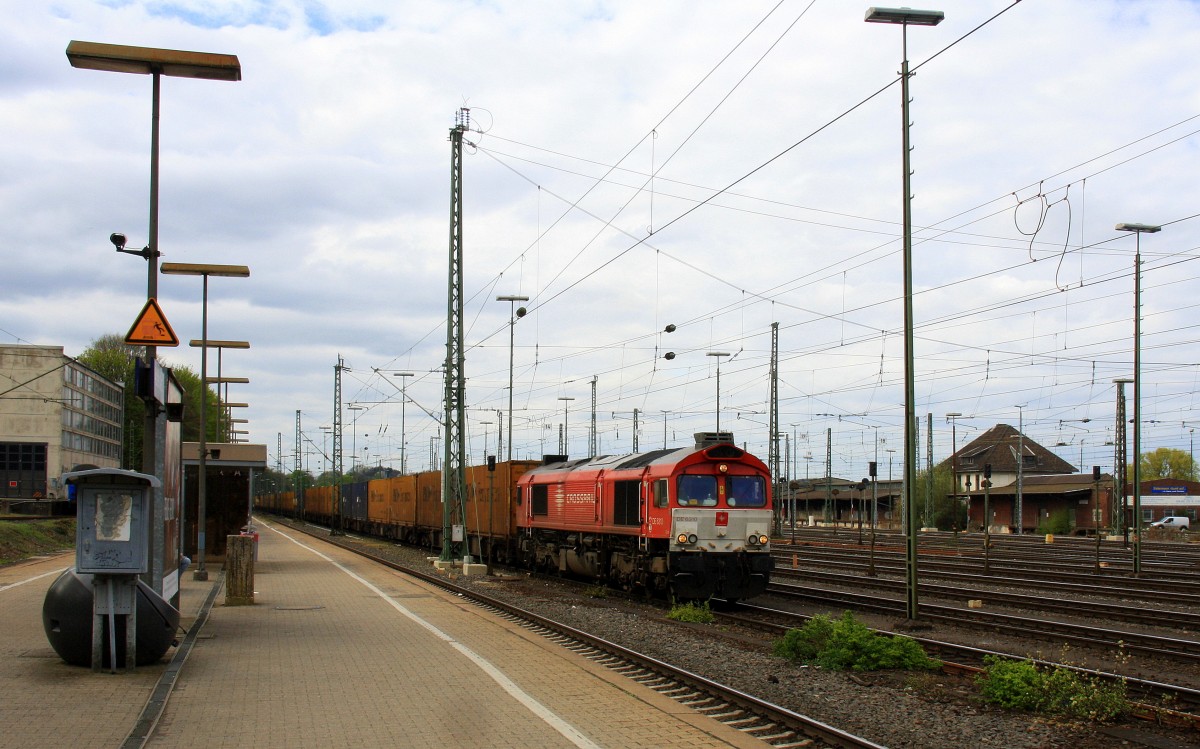 Die Class 66 DE6310  Griet  von Crossrail fährt mit viel Dieselpower mit einem P&O Ferrymasters Containerzug aus Gallarate(I) nach Zeebrugge(B) bei der Ausfahrt von Aachen-West und fährt in Richtung Montzen/Belgien.
Aufgenommen vom Bahnsteig in Aachen-West bei Sonne und Regenwolken am Nachmittag vom 6.4.2014. 