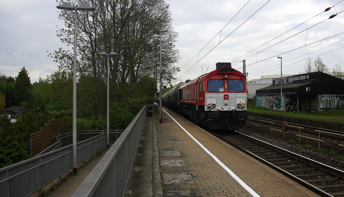 Die Class 66 DE6310  Griet  von Crossrail kommt mit einem langen Silozug durch Kohlscheid aus Buna-Werke(D) nach Herentals(B) und fährt die Kohlscheider-Rampe hoch nach Aachen-West.
Bei Regenwolken am Morgen vom 30.4.2015.