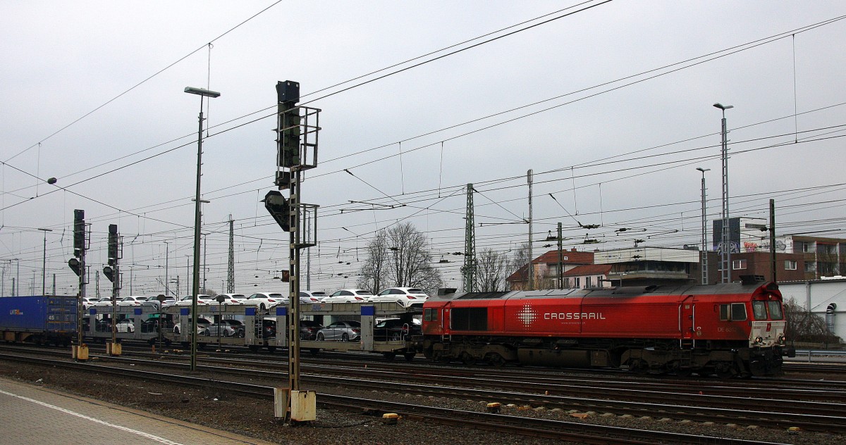 Die Class 66 DE6312  Alix  von Crossrail fährt  viel Dieselpower mit einem sehr langen Mercedes-Autozug aus Kornwestheim nach Zeebrugge-Ramskapelle(B) bei der Ausfahrt aus Aachen-West in Richtung Montzen/Belgien.
Aufgenommen vom Bahnsteig in Aachen-West am 14.3.2015.