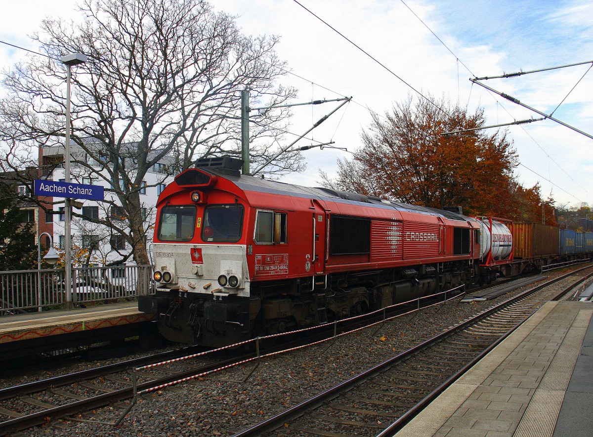 Die Class 66 DE6314  Hanna  von Crossrail  kommt aus Richtung Aachen-West mit einem langen Containerzug aus Zeebrugge-Ramskapelle(B) nach Milano(I) und fährt durch Aachen-Schanz in Richtung Aachen-Hbf,Aachen-Rothe-Erde,Stolberg-Hbf(Rheinland)Eschweiler-Hbf,Langerwehe,Düren,Merzenich,Buir,Horrem,Kerpen-Köln-Ehrenfeld,Köln-West,Köln-Süd. 
Bei Sonne und Regenwolken am Nachmittag vom 4.11.2015.