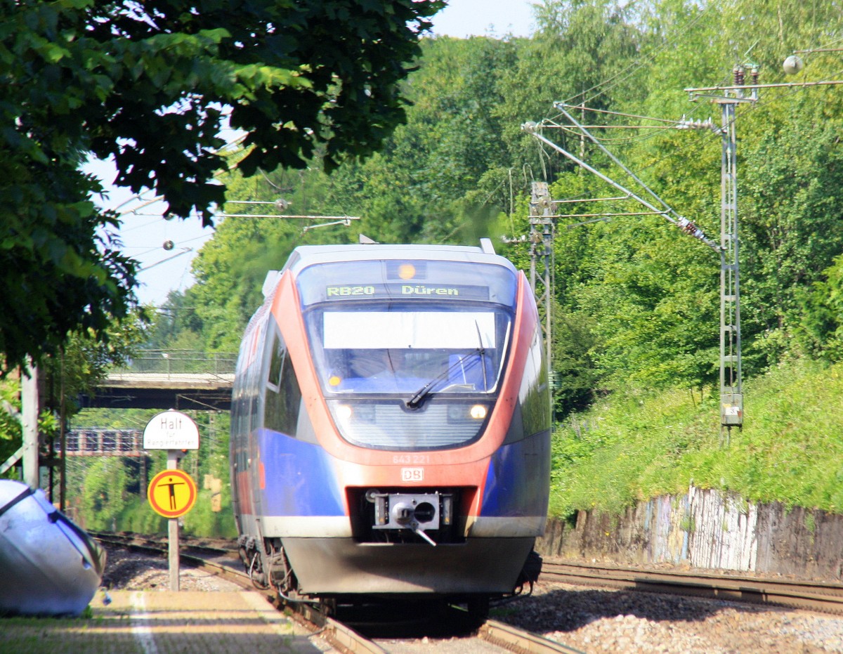 Die Euregiobahn (RB20) aus Herzogenrath-Düren kommt die Kohlscheider-Rampoe hoch aus Richtung Herzogenrath und hält in Kohlscheid und fährt in Richtung Richterich,Laurensberg,Aachen-West. 
Bei Sommerwetter am Nachmittag vom 8.6.2014.