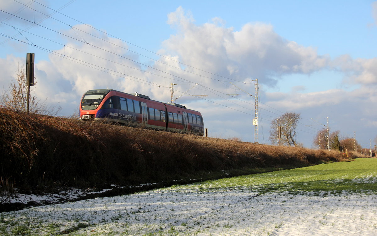 Die Euregiobahn RB20 Richtung Aachen unterwegs zwischen Kohlscheid und Richterich. Aufgenommen zwischen Aachen und Kohlscheid in Uersfeld,Richterich. 
Bei Schnee und Sonnenschein am Kalten Nachmittag vom 3.2.2019.