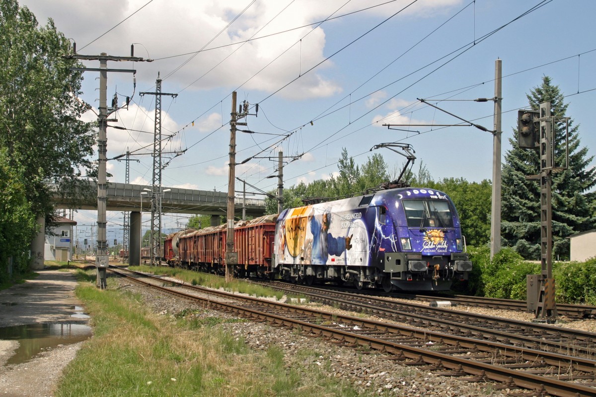 Die neue Werbelok 1116.077 mit G-45314 bei der Ausfahrt aus Ebenfurth richtung Wien Zvbf. am 12.7.14.