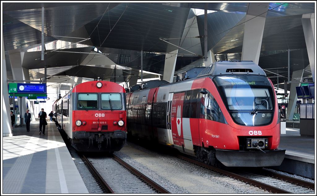 Die Reise nach Bratislava führt über den neuen Hbf in Wien. 80-71-025-3 steht an der Spitze des RE2516 über Marchegg nach Bratislava, währenddem 4024 036-7 nach Eisenstadt fährt. (31.05.2014)