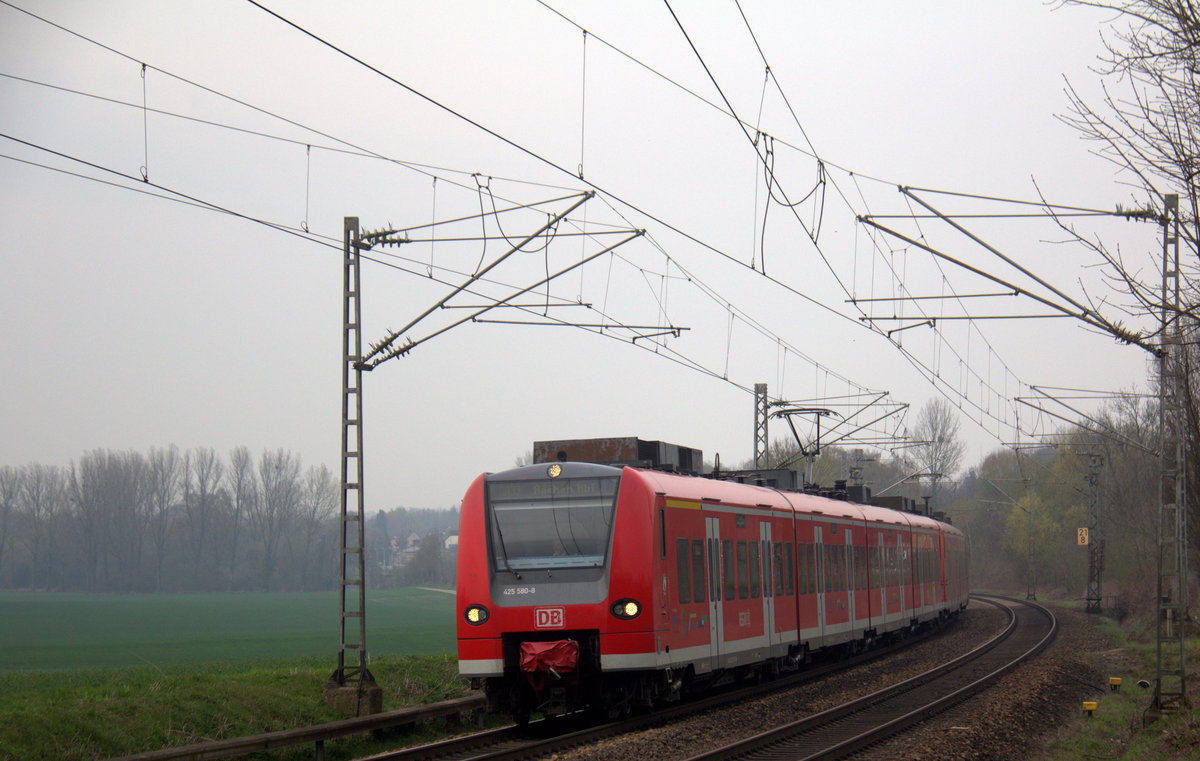 Die Rhein Niers Bahn (RB33) kommt aus Duisburg-Hbf,Heinsberg(Rheinland) nach Aachen-Hbf und kommt aus Rheydt,Wickrath,Beckrath,Herrath,Erkelenz,Baal,Hückelhoven-Baal,Brachelen,,Lindern,Süggerath,Geilenkirchen,Frelenberg,Zweibrüggen,Übach-Palenberg und fuhr in Richtung Finkenrath,Hofstadt,Herzogenrath,Kohlscheid,Richterich,Laurensberg,Aachen-West,Aachen-Schanz,Aachen-Hbf.
Aufgenommen von Bruchhausener Straße in Rimburg im Wurmtal. 
Bei Wolken am Nachmittag vom 9.4.2018.