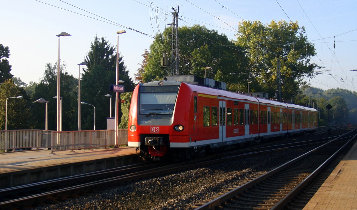 Die Rhein Niers Bahn (RB33) aus Aachen-Hbf-Heinsberg kommt aus Richtung Aachen-West,Laurensberg,Richterich, und fährt durch Kohlscheid und fährt in Richtung Herzogenrath.
Bei schönem Sonnenschein am Morgen vom 15.9.2014.