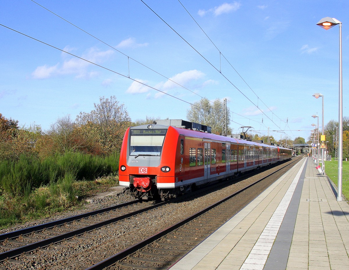 Die Rhein Niers Bahn (RB33) aus Duisburg-Hbf-Aachen-Hbf und kommt aus Richtung Rheydt,Wickrath,Beckrath,Herrath,Erkelenz,Baal,Hückelhoven-Baal,Brachelen,,Lindern,Süggerrath,Geilenkirchen,Frelenberg,Zweibrüggen und hält in Übach-Palenberg und fährt in Richtung Rimburg,Finkenrath,Hofstadt,Herzogenrath, Kohlscheid,Richterich,Laurensberg,Aachen-West. 
Bei schönem Novemberwetter am Mittag vom 8.11.2014.