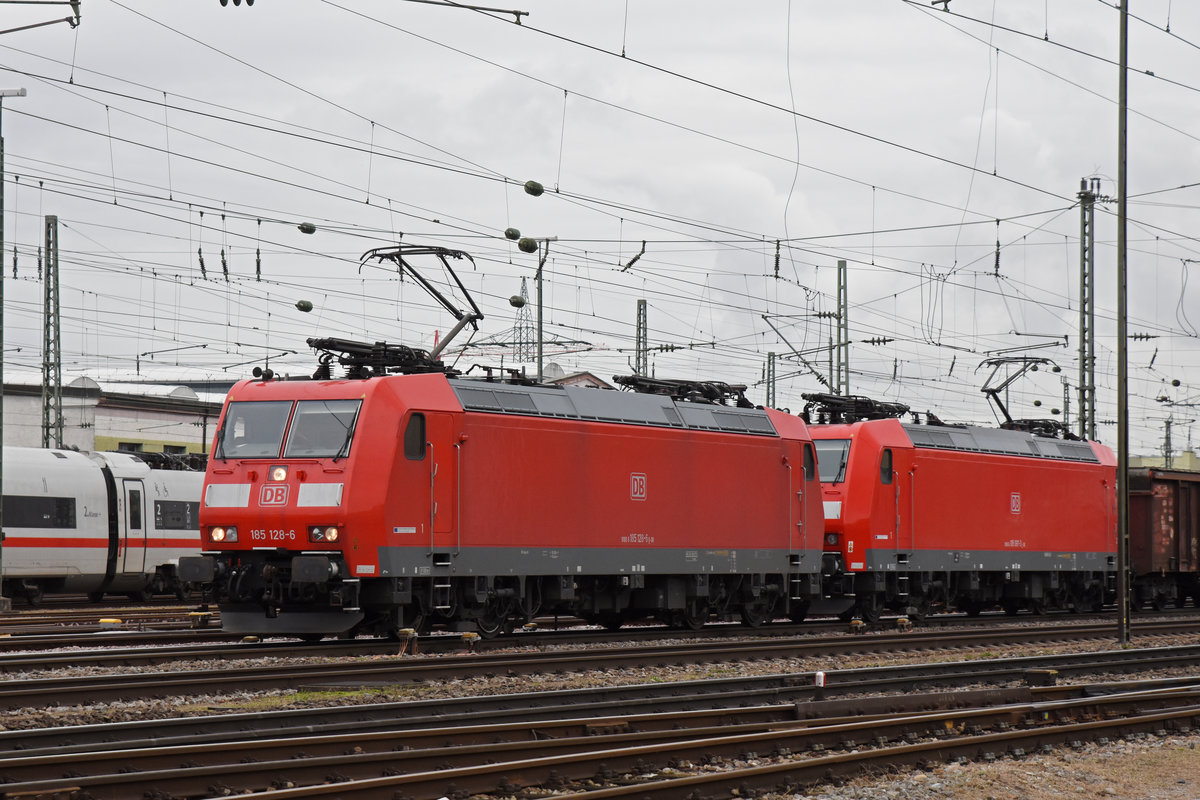 Doppeltraktion, mit den DB Loks 185 128-6 und 185 097-3, durchfährt den badischen Bahnhof. Die Aufnahme stammt vom 08.11.2019.