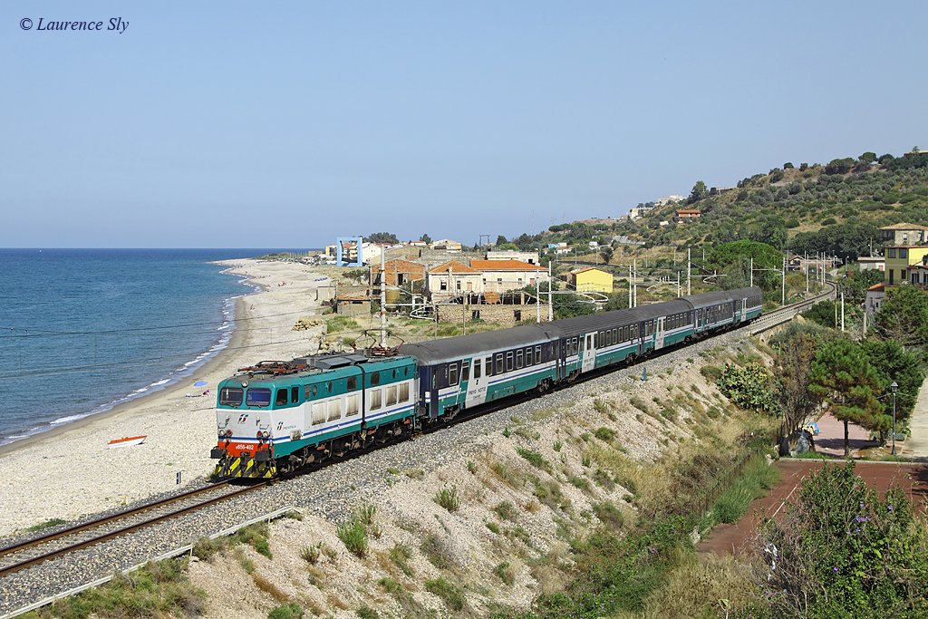 E.656 492 passes Torremuzza whilst working IC781, 1310 Messina Centrale-Palermo Centrale, 8 September 2013.