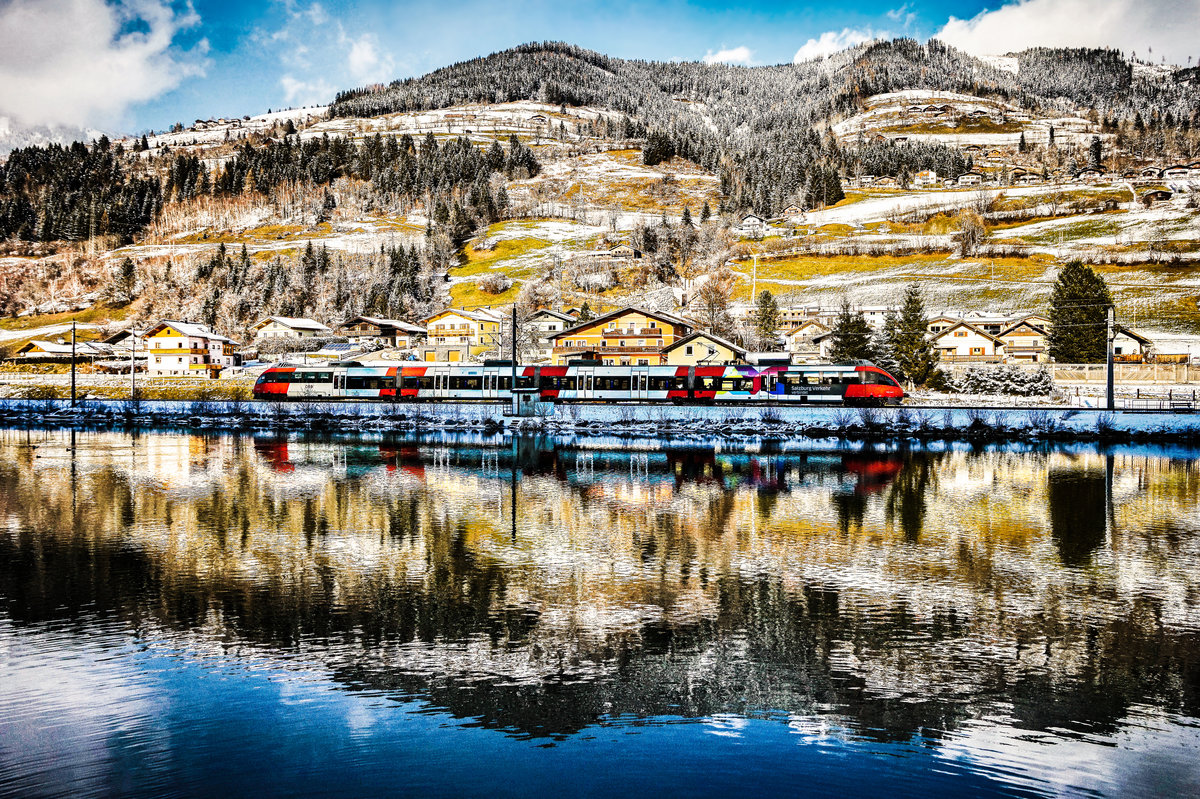 Ein 4024 fährt als REX 1513 (Wörgl Hbf - Schwarzach-St. Veit) bei Högmoos, nahe Grieß im Pinzgau vorüber.
Aufgenommen am 3.12.2017.