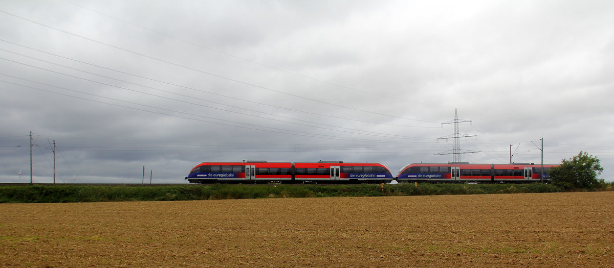 Ein Blick auf die Euregiobahn RB20 in Richtung Aachen-West. 
Aufgenommen zwischen Aachen und Kohlscheid in Uersfeld,Richterich. 
Bei Regenwolken am Nachmittag vom 17.8.2019.