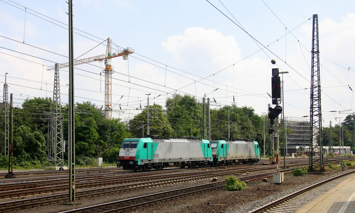 Ein Nachschuss von Zwei Cobra 2835 und 2842 fahren als Lokzug aus Aacen-West in Richtung Montzen/Belgien. Aufgenommen vom Bahnsteig in Aachen-West bei Sonne und Wolken am Mittag vom 4.8.2014.