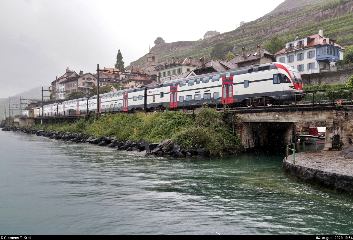 Ein RABe 511 (Stadler KISS) fährt bei einem Regenschauer vorbei am Plage de la Lisette in Saint-Saphorin (CH).

🧰 Léman Express (LEX | SBB | SNCF)
🚝 SCF23231 Annemasse (F)–Chêne-Bourg (CH), weiter als S L4 Chêne-Bourg (CH)–Genève (CH), weiter als RE 18423 Genève (CH)–Vevey (CH)
🚩 Bahnstrecke Vallorbe–Domodossola (Simplonstrecke | 100/200)
🕓 4.8.2020 | 10:54 Uhr
