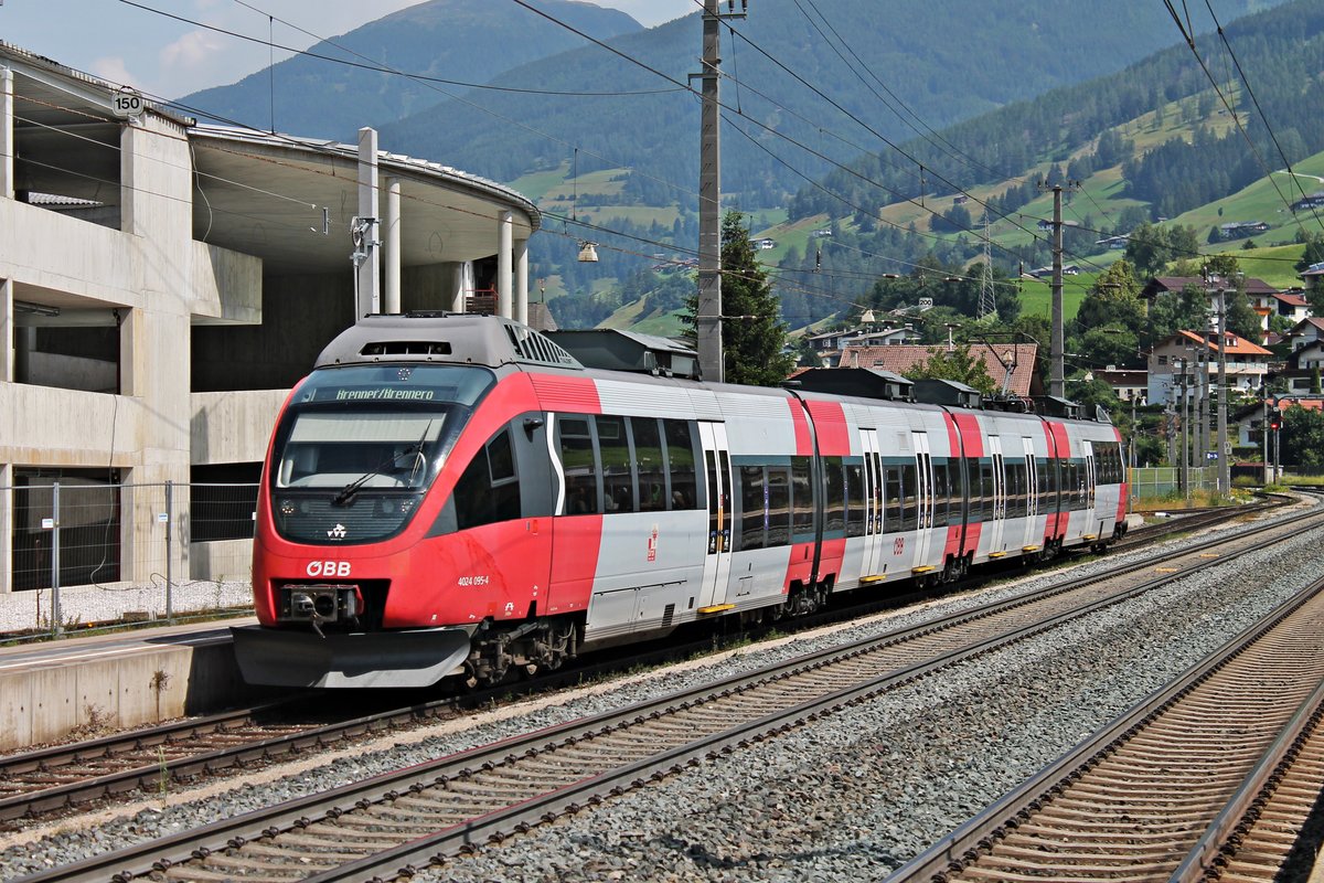 Einfahrt am 03.07.2018 von ÖBB 4024 095-4 als REX (Kuftsein - Brenner/Brennero) in den Bahnhof von Matrei am Brenner.