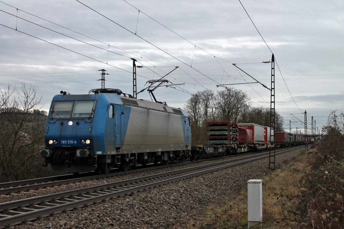 Einfahrt am 14.02.2014 von Railtraxx 185 515-4 in den Bahnhofsbereich von Müllheim (Baden).