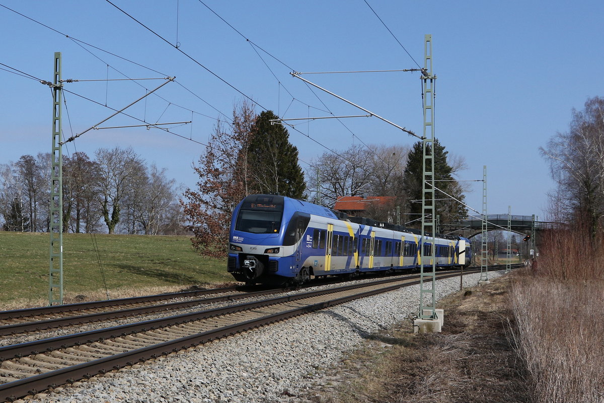ET  313 war am 7. März 2021 bei Übersee am Chiemsee von Salzburg in Richtung München unterwegs.